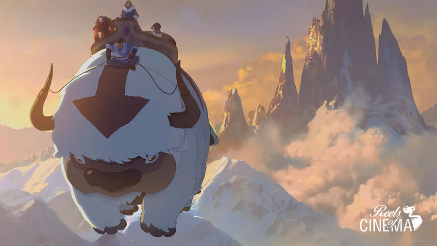 Aang y sus compañeros viajan sobre Appa por un paisaje montañoso